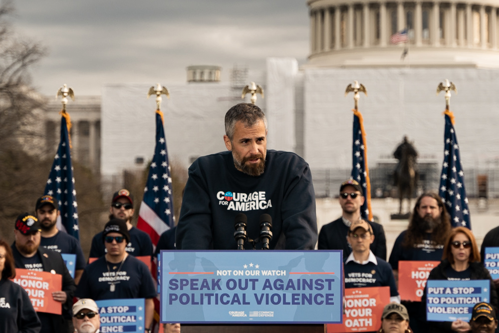 Michael Fanone speaks in front of the U.S. Capitol.